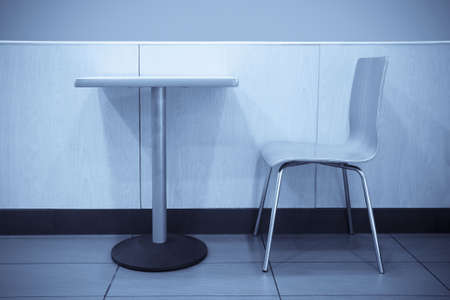 chair and table in fast food dining room の写真素材