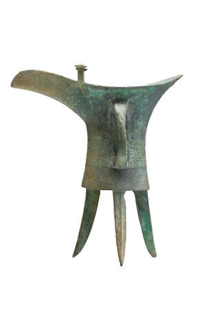 ancient bronze drinking vessel of jue isolated on whiteの写真素材