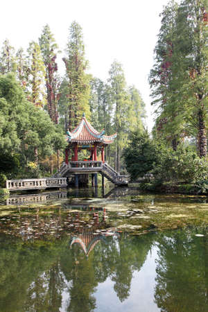 chinese traditional small pavilion in the garden の写真素材