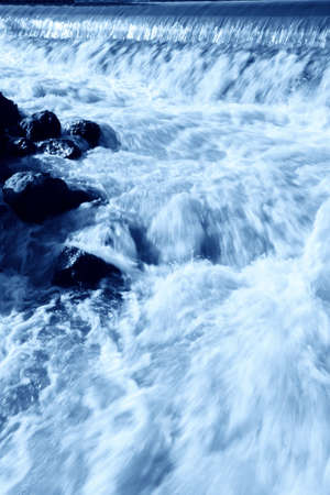 running water in a drainage gateの写真素材