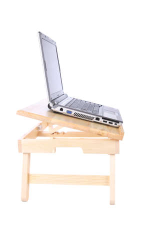 laptop on the small table with white backgroundの写真素材