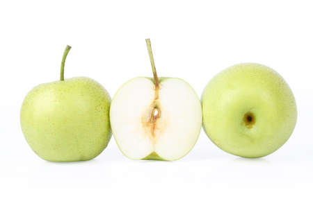 two and a half ripe green pears isolated on white backgroundの写真素材