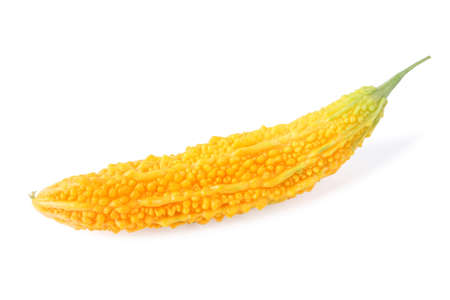 a yellow balsam pear isolated on white の写真素材
