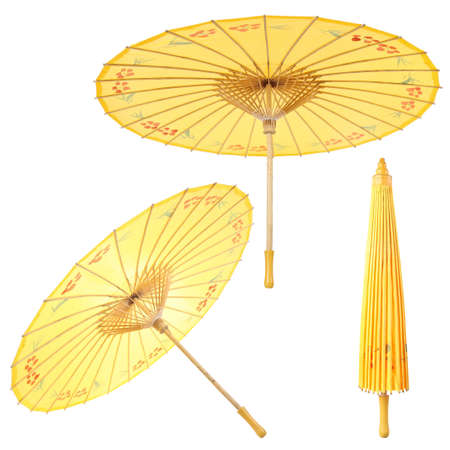 chinese traditional yellow paper umbrella with white backgroundの写真素材