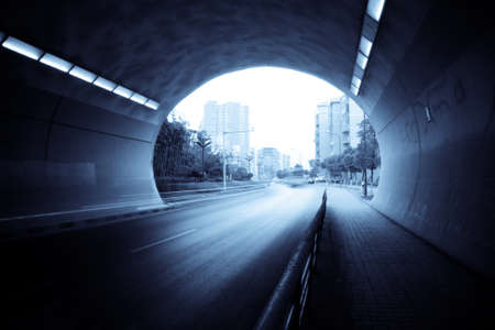 tunnel exit with traces of light vehicles to moveの写真素材