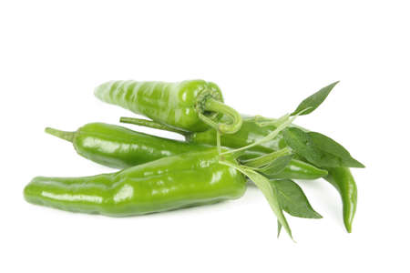 four green pepper and leaf isolated on white の写真素材