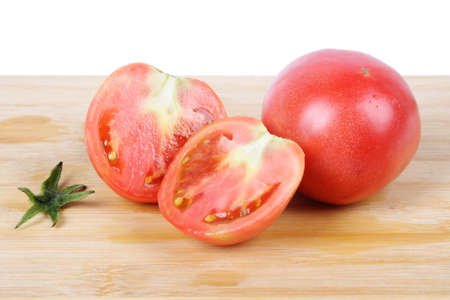 two tomato on cutting board with white backgroundの写真素材