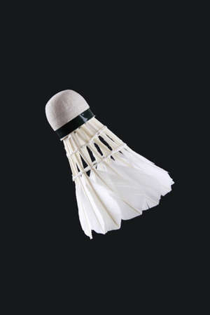 a white shuttlecock isolated on blackの写真素材