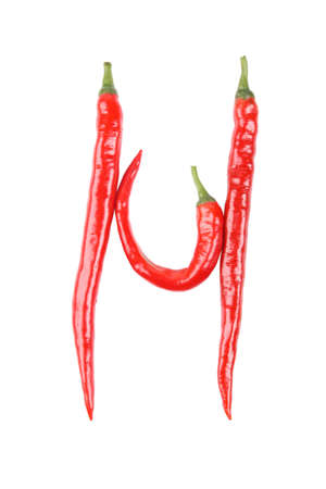 three red hot peppers spelling the letter  "h" の写真素材