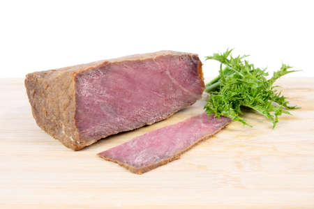 close up of the cooked beef on a  board with whiteの写真素材
