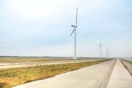 abstract background of desolate with wind turbines in the riversideの写真素材