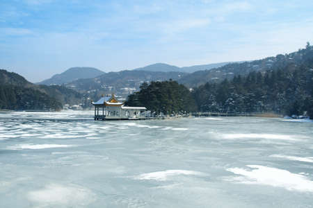 winter landscape with lake covered with ice. lushan ,China の写真素材