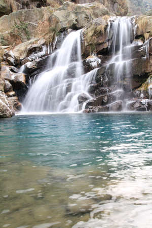 waterfall and deep pool at winter の写真素材