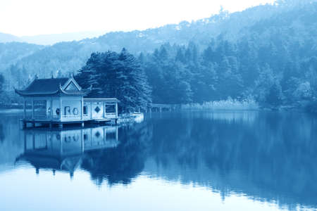 chinese traditional pavilion in the lakeの写真素材