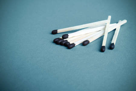 close up of the some matches isolated on blue backgroundの写真素材