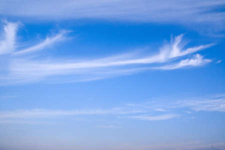 sky background,  white fluffy clouds  against  blue sky.の写真素材
