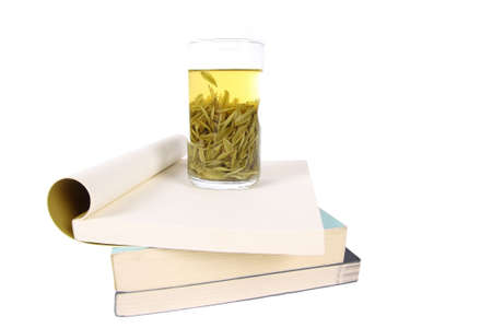 a cup tea on the books with white backgroundの写真素材