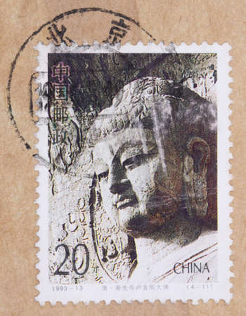 CHINA - CIRCA 1993: A stamp printed in China shows Head statue of buddha, circa 1993 のeditorial素材