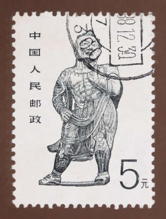 CHINA - CIRCA 1988: Stamp printed in China shows image of ancient hercules,Buddhist grotto art in China, circa 1988 のeditorial素材