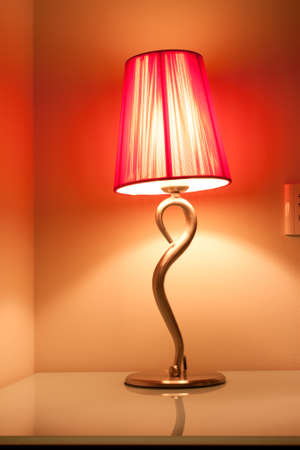 a warm table lamp at hotel の写真素材