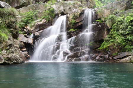 double dragon waterfall at early summer in lushan,Chinaの写真素材