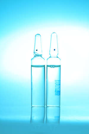 medical ampoules isolated with blue tone