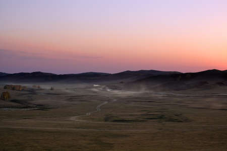 grassland at dusk,prairie under sunset glowの写真素材