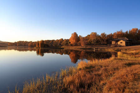 autumn scenery of the tranquil lake in morningの写真素材