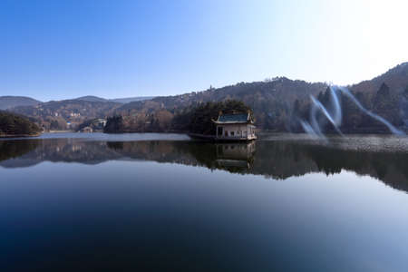 quiet lake and misty smoke in lushan scenic area,China