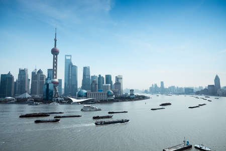 shanghai pudong skyline and busy huangpu riverのeditorial素材