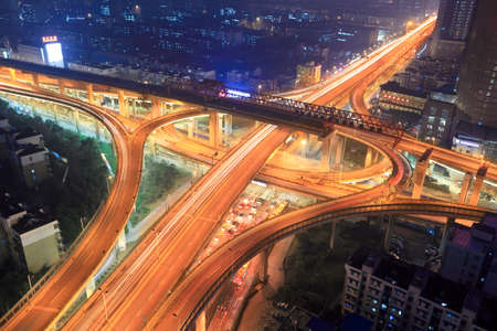overpass in modern city at nightの写真素材