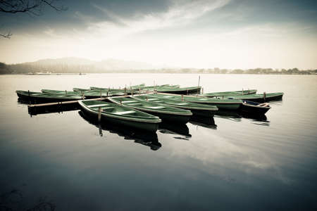 some boats on the west lake in hangzhouの写真素材