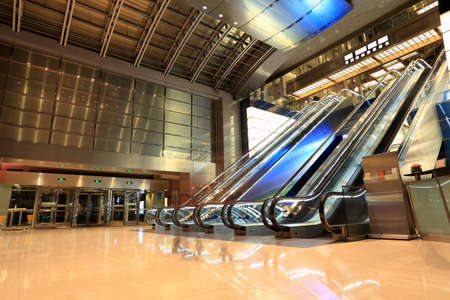 escalators in the modern lobby at nightのeditorial素材