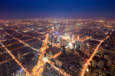aerial view of the bright lights of the metropolis at night in shanghaiの写真素材