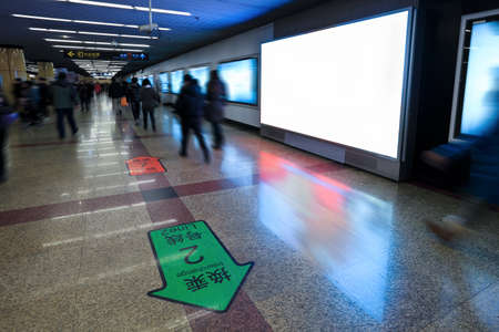 blank electronic screen on the wall in subway station channel