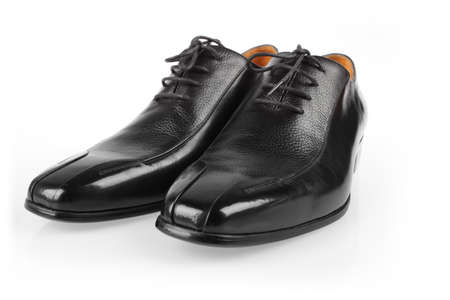 black leather shoes with white backgroundの写真素材