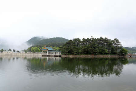mist and a pavilion on the lake,pure and fresh scenery in lushanの写真素材