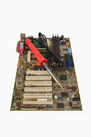 soldering iron and computer motherboard,repair concept