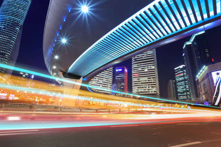 light traces through flyover,night traffic on the downtown in shanghai