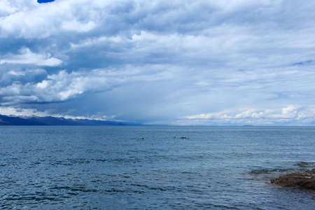namtso lake with overcast sky in tibetの写真素材