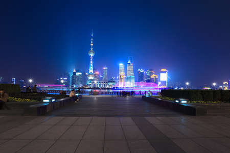 shanghai skyline with traveler at nightの写真素材