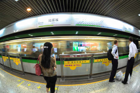 shanghai subway station by fish-eye view with passengerのeditorial素材