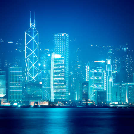 hong kong skyline at night in victoria harborの写真素材