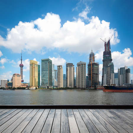 the development of shanghai skyline with wooden floorの写真素材