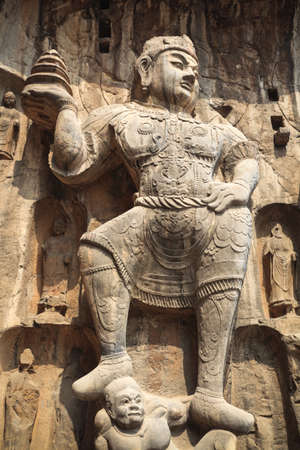 buddha statue closeup,the heavenly kings are solemn and mighty in longmen grottoes,luoyang,Chinaの写真素材