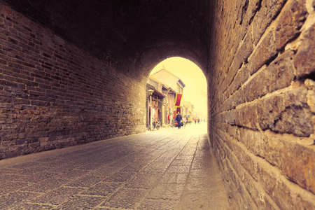 ancient city gate tower entrance,through time in luoyang,Chinaの写真素材