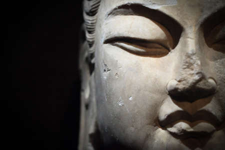 religion stone sculpture of buddha closeup