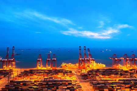 shanghai container terminal at nightfallの写真素材
