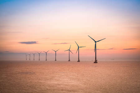 offshore wind farm at dusk in the east China sea.の写真素材