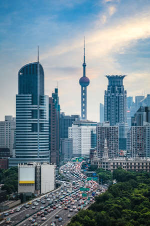 elevated road vehicles with shanghai skyline at dusk,modern city and traffic background.の写真素材